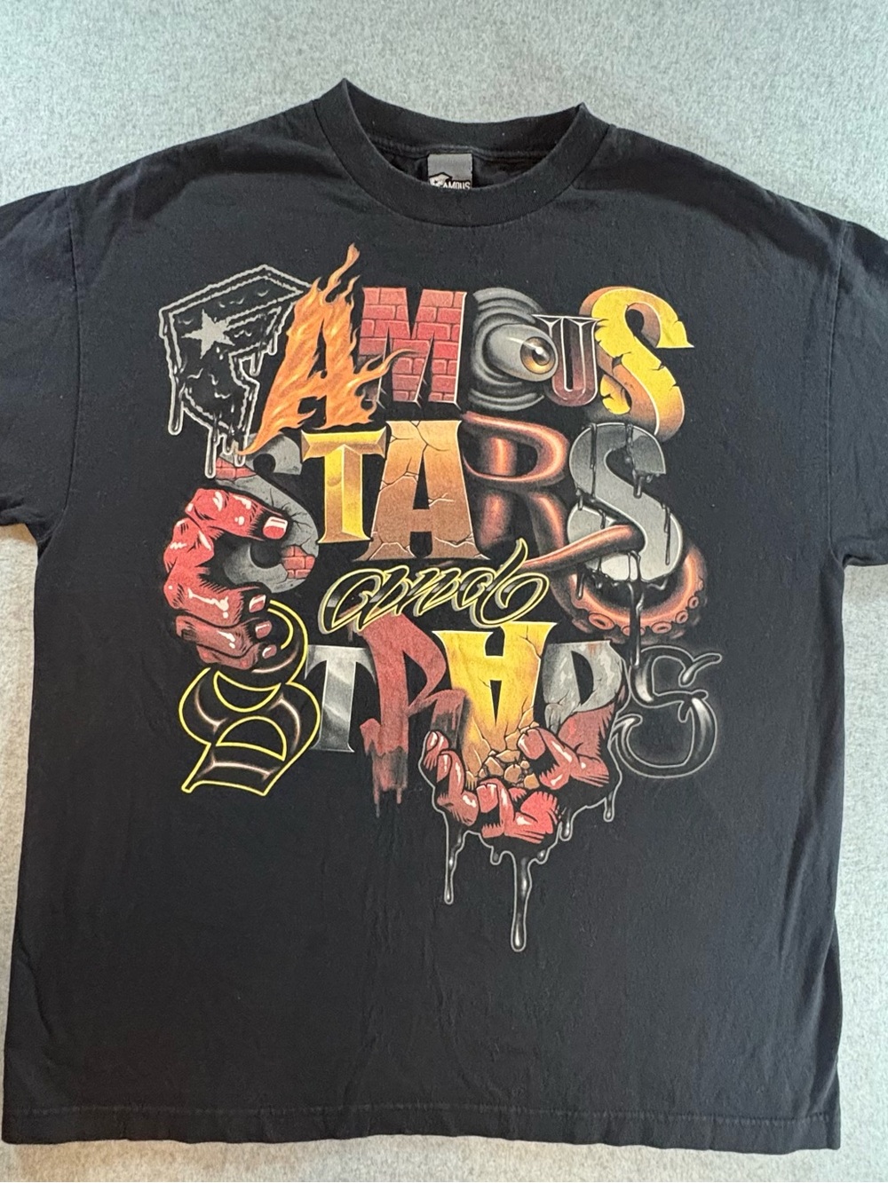 Famous Stars & Straps Black Graphic Tee with Red Brick Accents